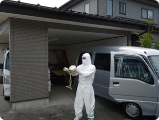 Keiko’s father measures the radiation dose around the house with a Geiger counter