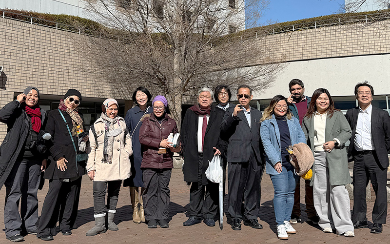 Group photo in front of the TMU Co-op Cafeteria and bookstore — a memorable visit!